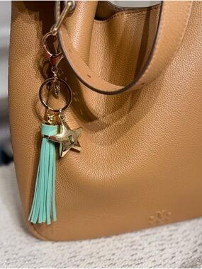 NEW. 🩵 Bag charm or keychain. Faux leather tassel and puffy star charm